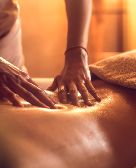 A masseuse giving a calming massage treatment, focusing on relaxation and wellness.