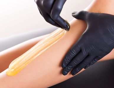 A chic arrangement of skincare products on a shelf at a beauty salon for professional use.